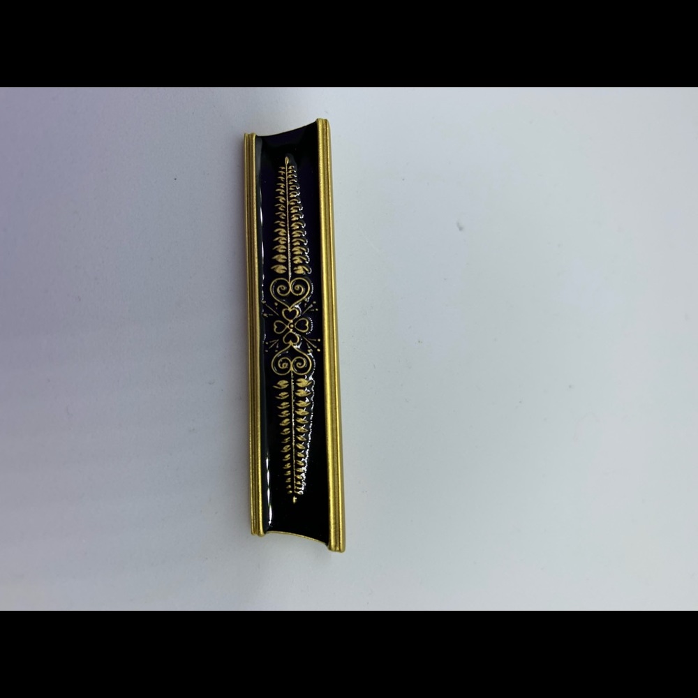 Gold and black broach